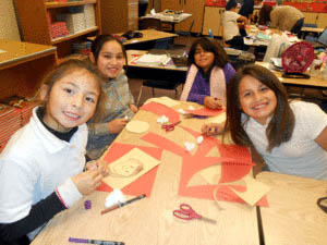 Photo courtesy Youth Alliance Four young girls from Hollister work on an art project during a Youth Alliance after-school program.